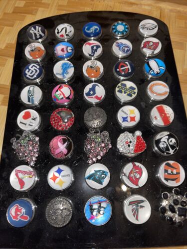 40 Piece Lot Of Snap Charm Buttons On Display For Resell